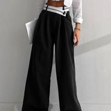 Pantalón ancho con cinturilla asimétrica